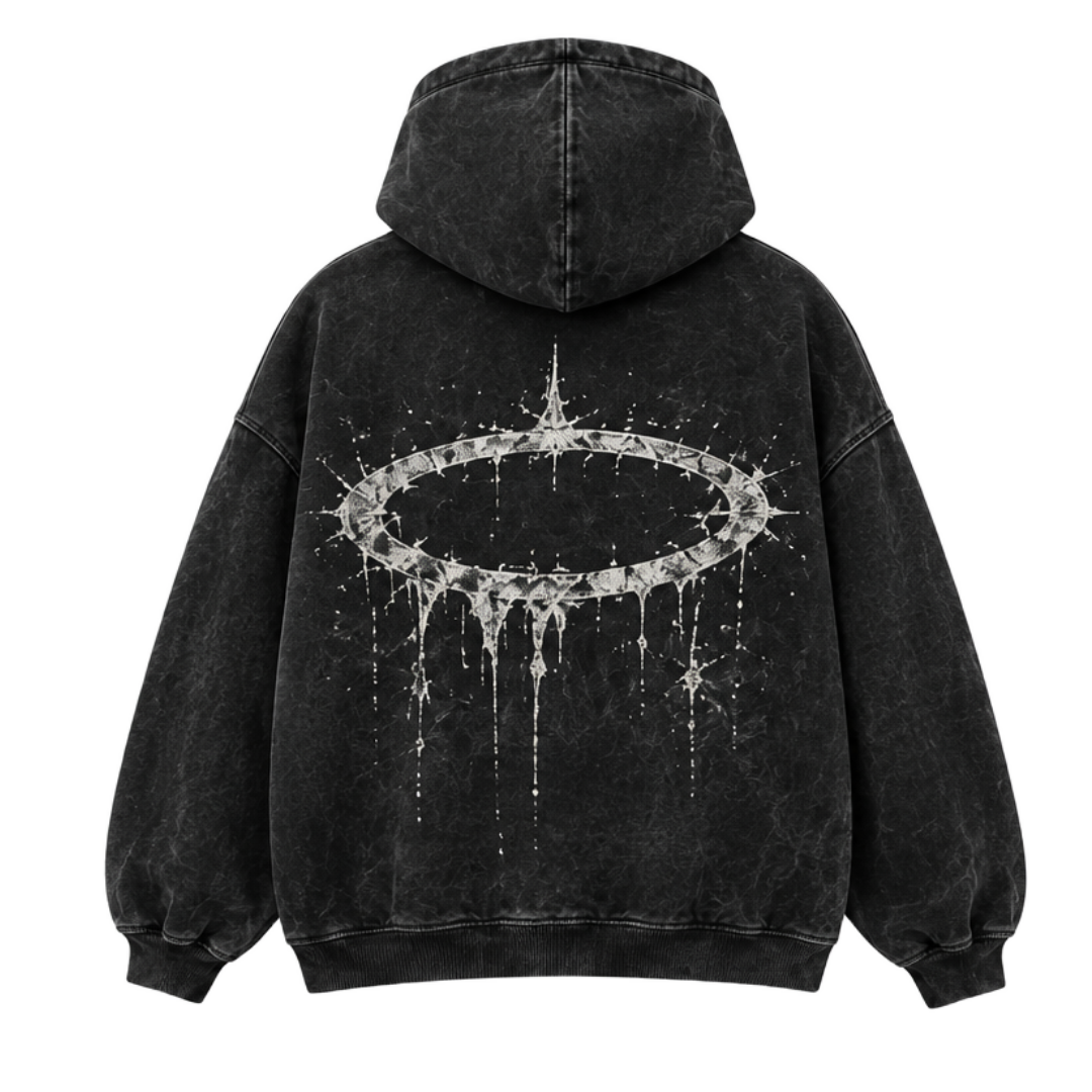 An oversized hoodie, seen from behind in shadow